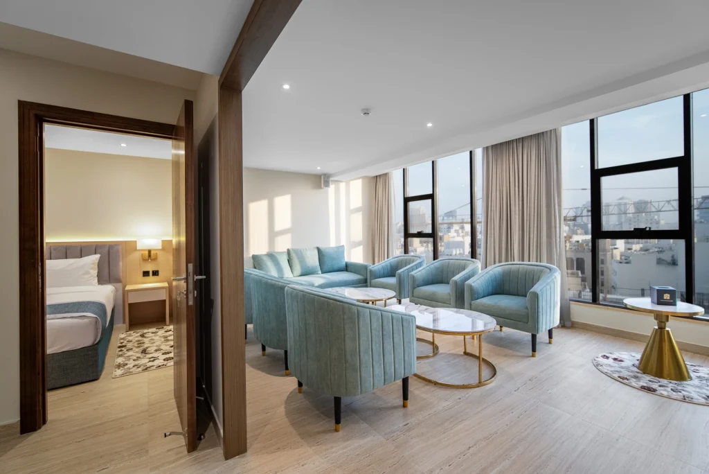 Deluxe Premium Suite with master bedroom with a King bed, a secondary guest room, and a sprawling living/dining area
